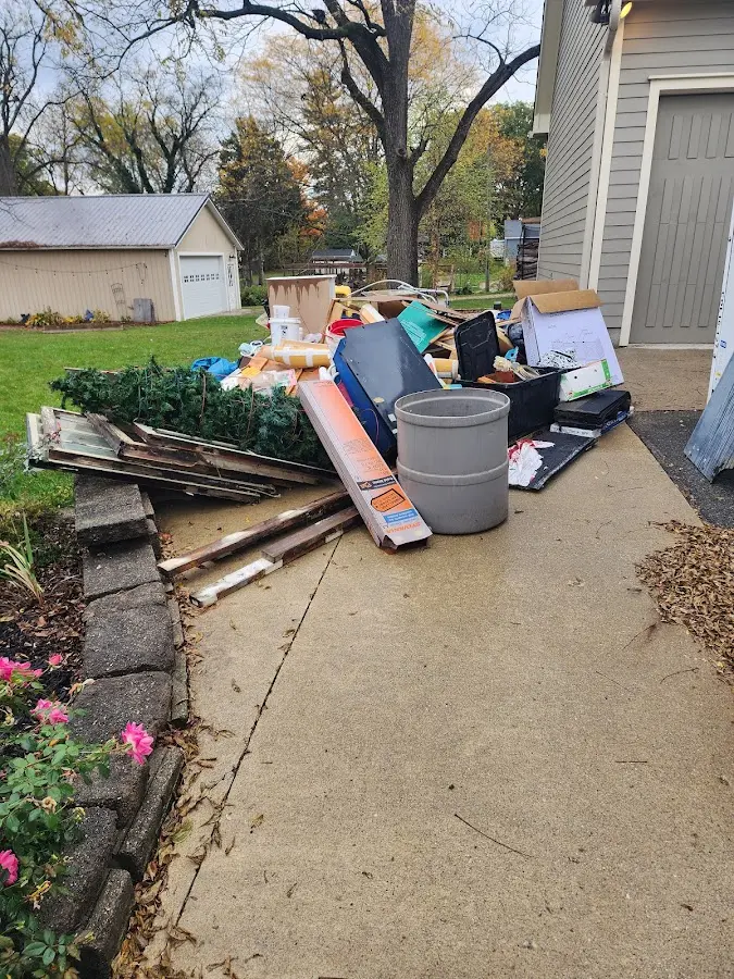 Dumpster being loaded with debris for 3 Yard Dumpster Rental in Pennsbury